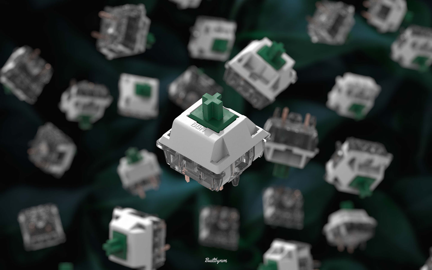 Close-up shot of a BBN Linear mechanical keyboard switch with an assortment of BBN Linear switches falling behind it with a green background with dark green leaves