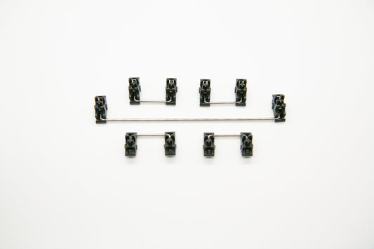 Overhead shot of PCB mounted black mechanical keyboard Durock stabilizer kit in 7u configuration with screws and washers
