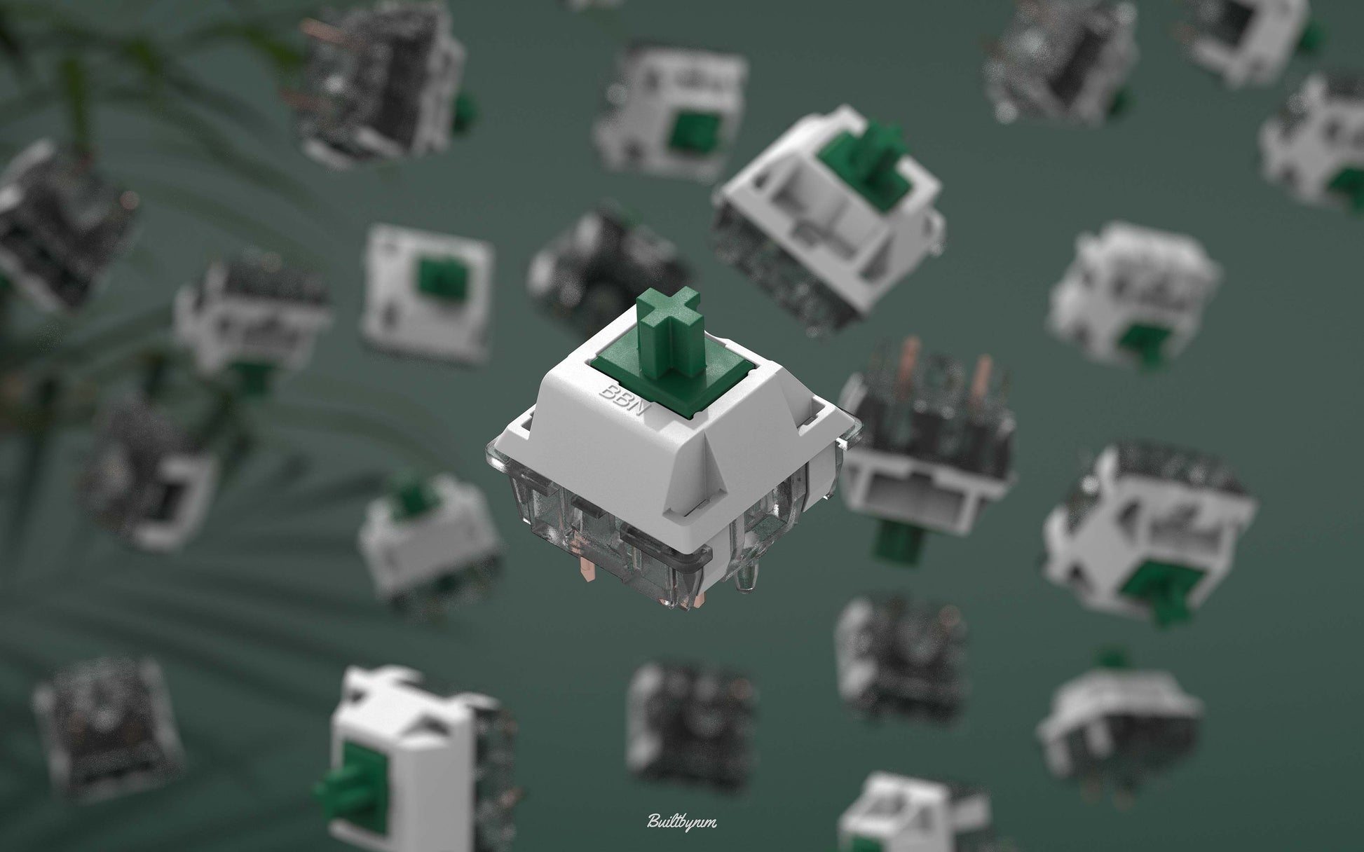 Close-up shot of a BBN Linear mechanical keyboard switch with an assortment of BBN Linear switches falling behind it with a green background and stringy plant leaves on the left