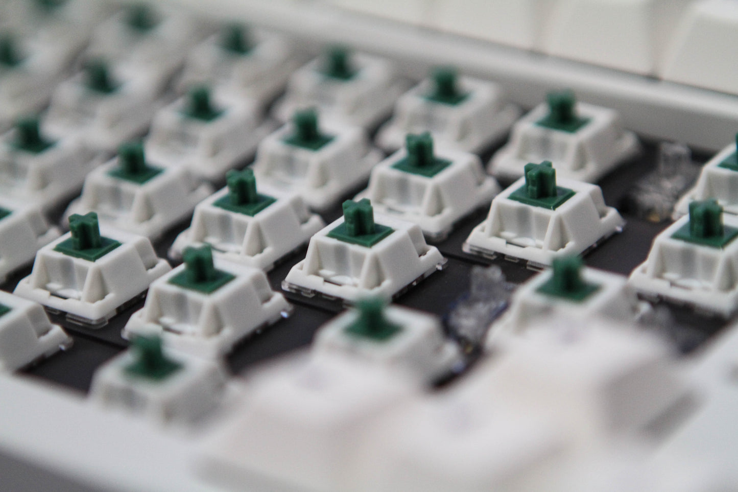 Close-up shot of BBN Linear switches in the central area of a keyboard with keycaps removed